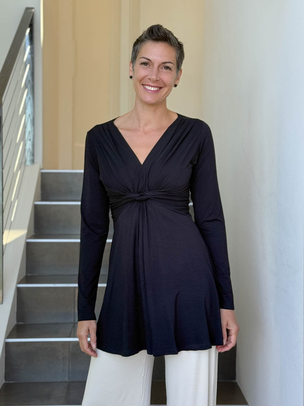 caraucci long sleeve black tunic in midweight rayon jersey with twisted front detail #color_black