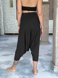 caraucci draped black harem style movement pants with soft waistband and cropped silhouette #color_black