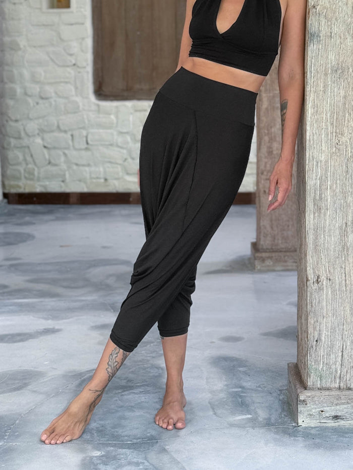 caraucci draped black harem style movement pants with soft waistband and cropped silhouette #color_black