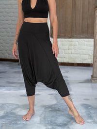caraucci draped black harem style movement pants with soft waistband and cropped silhouette #color_black