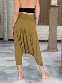 caraucci draped earthy brass harem style movement pants with soft waistband and cropped silhouette #color_brass