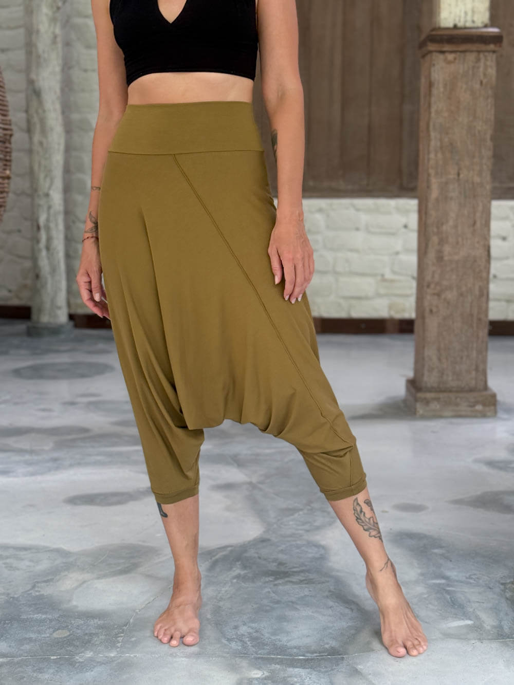 caraucci draped earthy brass harem style movement pants with soft waistband and cropped silhouette #color_brass