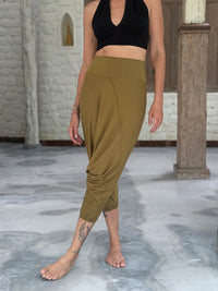 caraucci draped earthy brass harem style movement pants with soft waistband and cropped silhouette #color_brass