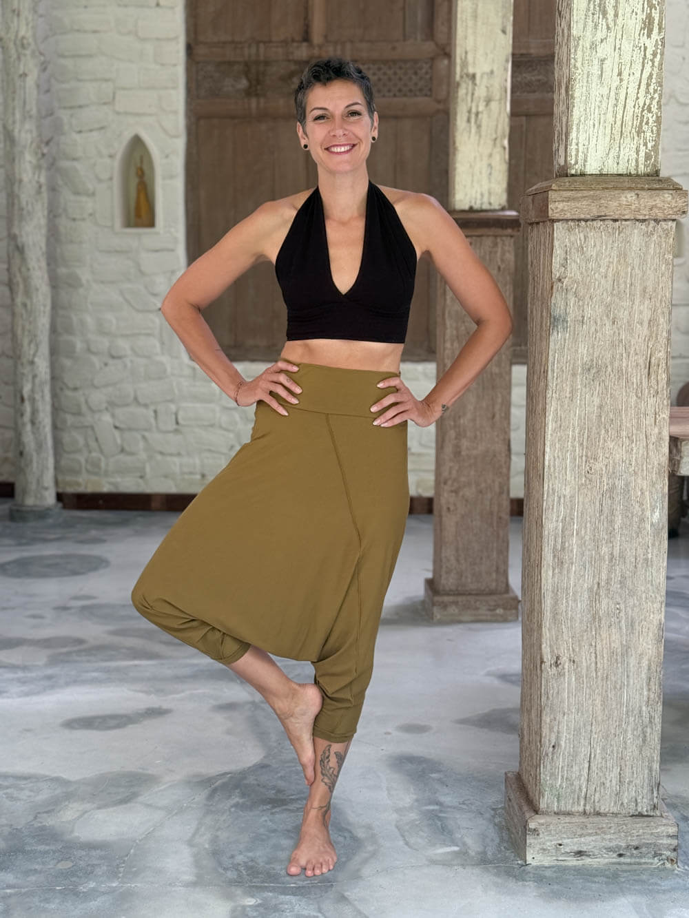caraucci draped earthy brass harem style movement pants with soft waistband and cropped silhouette #color_brass