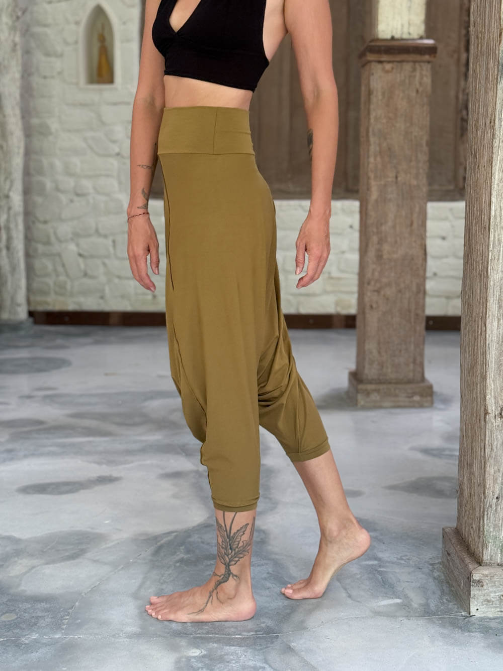 caraucci draped earthy brass harem style movement pants with soft waistband and cropped silhouette #color_brass