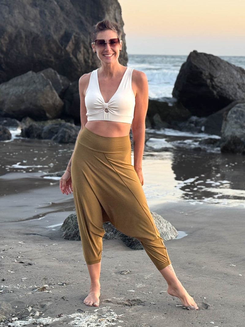 caraucci draped earthy brass harem style movement pants with soft waistband and cropped silhouette #color_brass