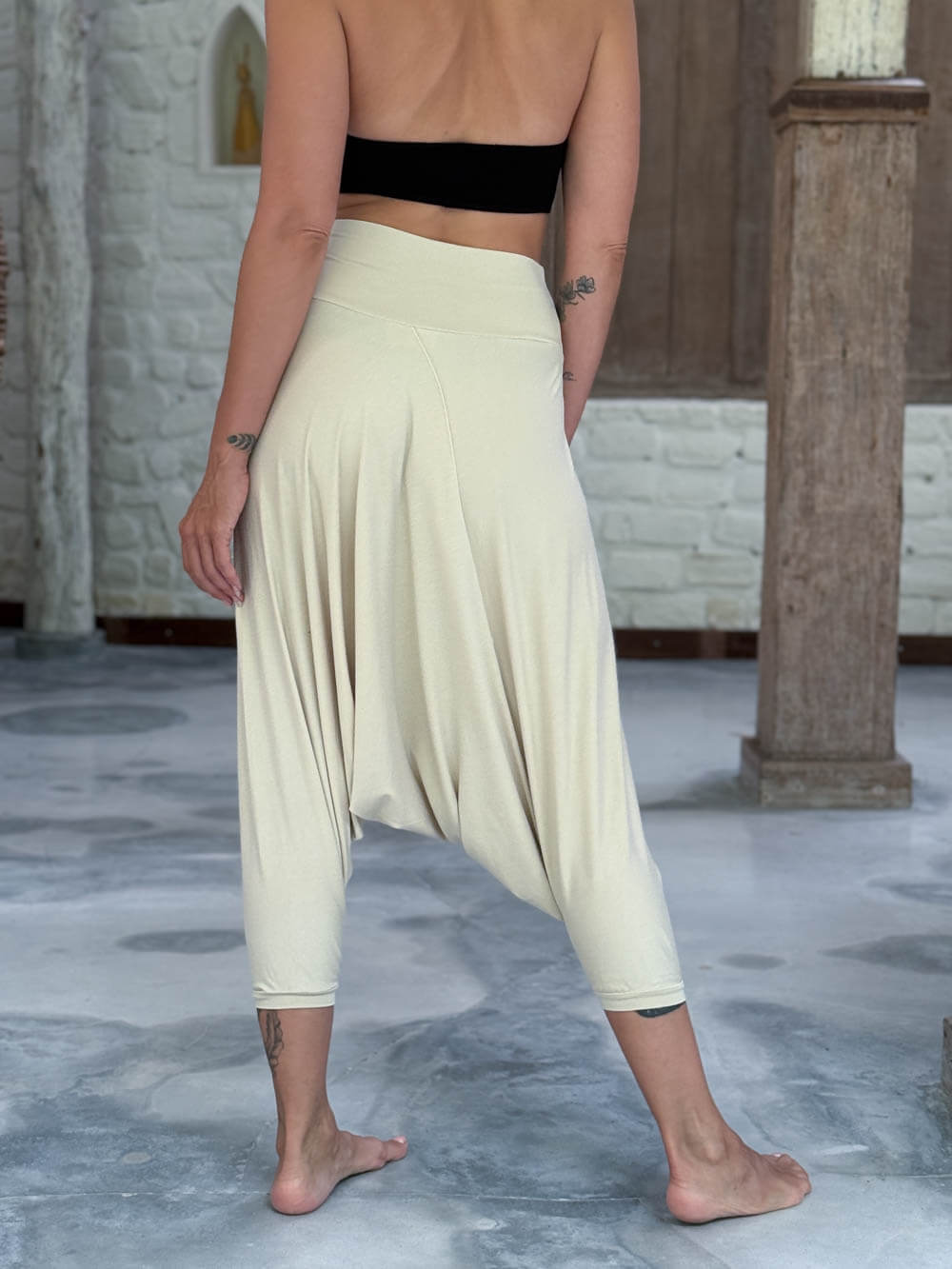 caraucci draped cream harem style movement pants with soft waistband and cropped silhouette #color_cream
