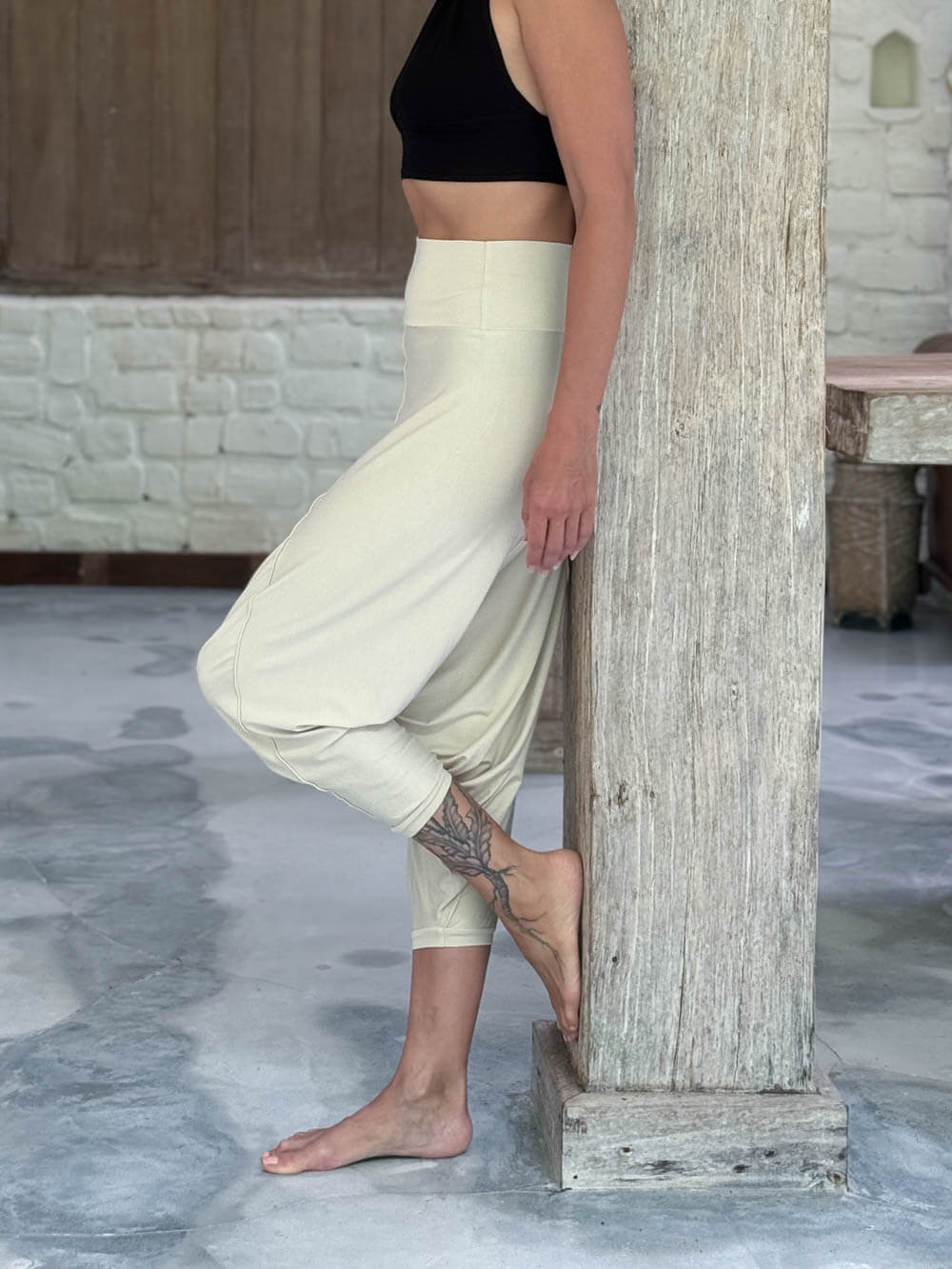 caraucci draped cream harem style movement pants with soft waistband and cropped silhouette #color_cream