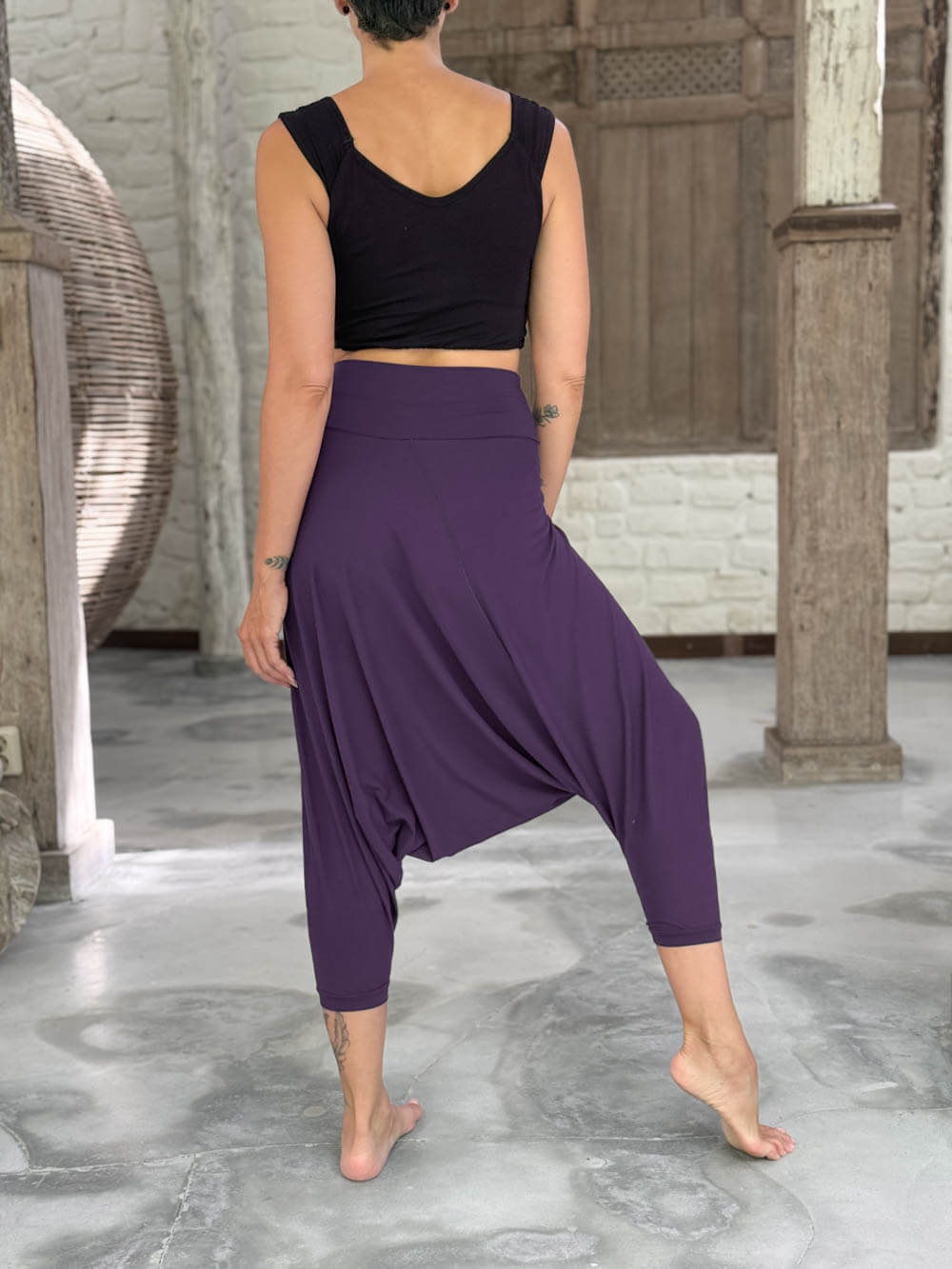 caraucci draped purple harem style movement pants with soft waistband and cropped silhouette #color_plum
