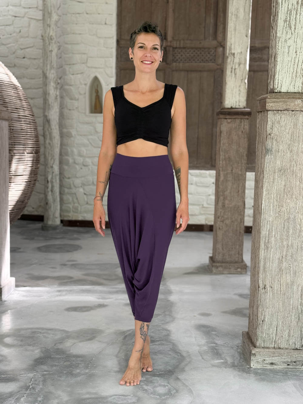 caraucci draped purple harem style movement pants with soft waistband and cropped silhouette #color_plum
