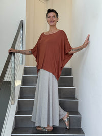 CARAUCCI Nafisa Top in Copper with a wide neckline, fluid draped sleeves and relaxed silhouette. #color_copper