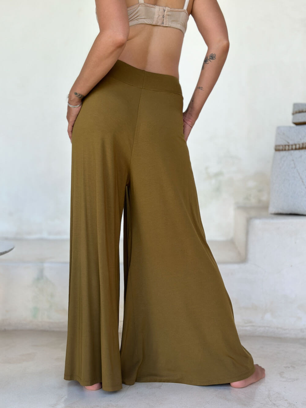 caraucci high waisted wide leg gold flare pants with side pockets #color_brass