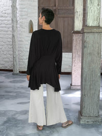 caraucci peplum tunic in black lightweight rayon jersey with v neckline and asymmetrical hem #color_black