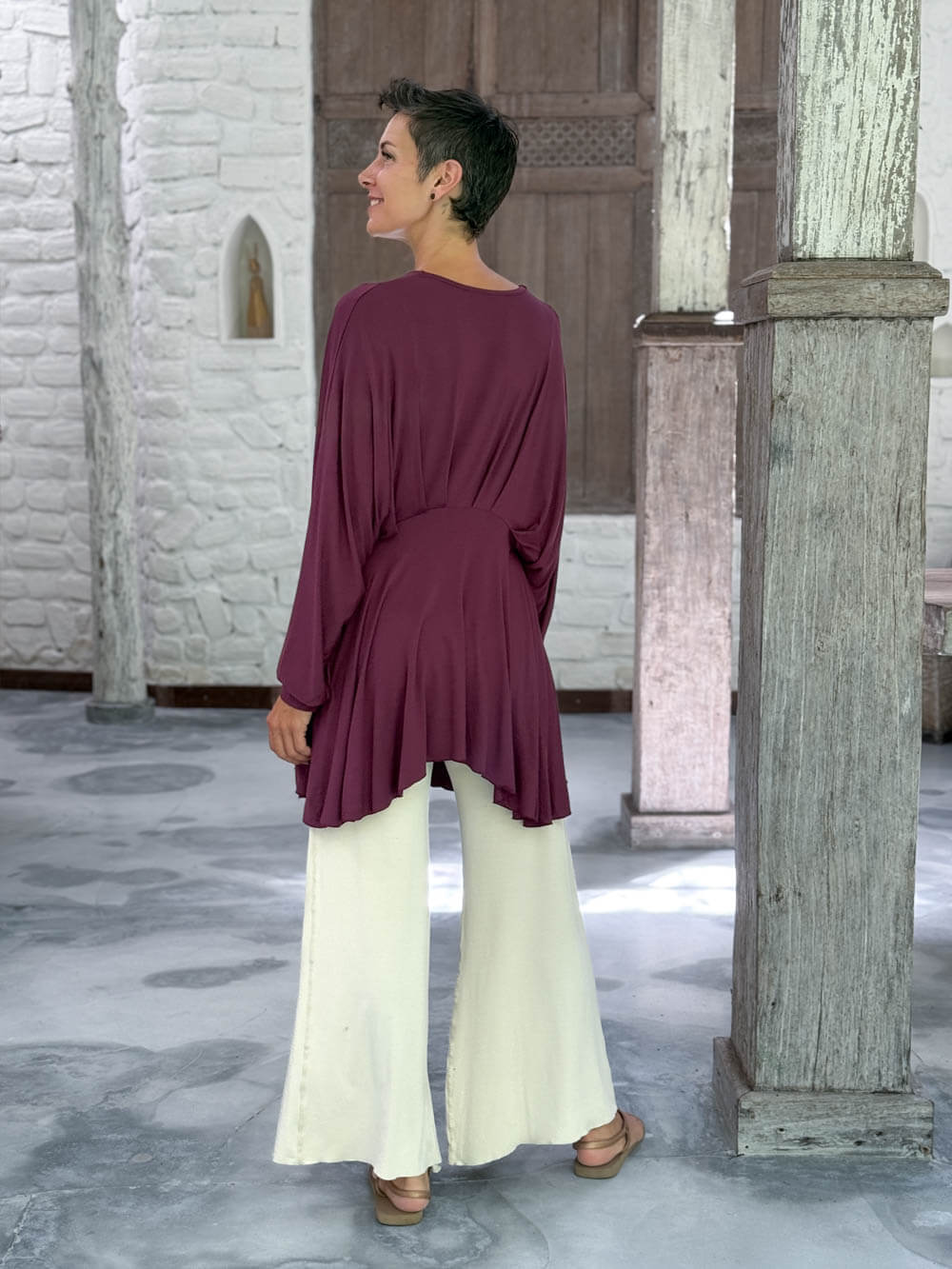 caraucci peplum tunic in purple lightweight rayon jersey with v neckline and asymmetrical hem #color_jam