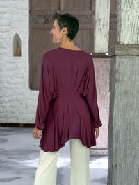 caraucci peplum tunic in purple lightweight rayon jersey with v neckline and asymmetrical hem #color_jam