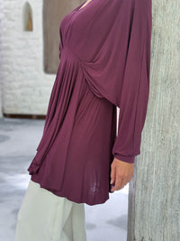 caraucci peplum tunic in purple lightweight rayon jersey with v neckline and asymmetrical hem #color_jam