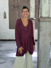 caraucci peplum tunic in purple lightweight rayon jersey with v neckline and asymmetrical hem #color_jam