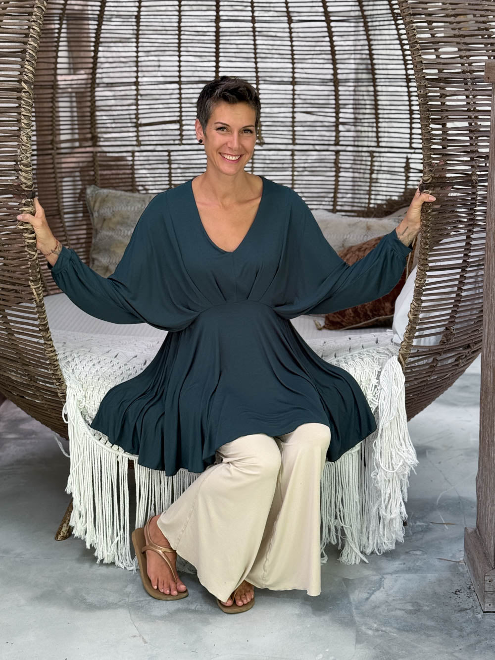 caraucci peplum tunic in teal blue lightweight rayon jersey with v neckline and asymmetrical hem #color_teal