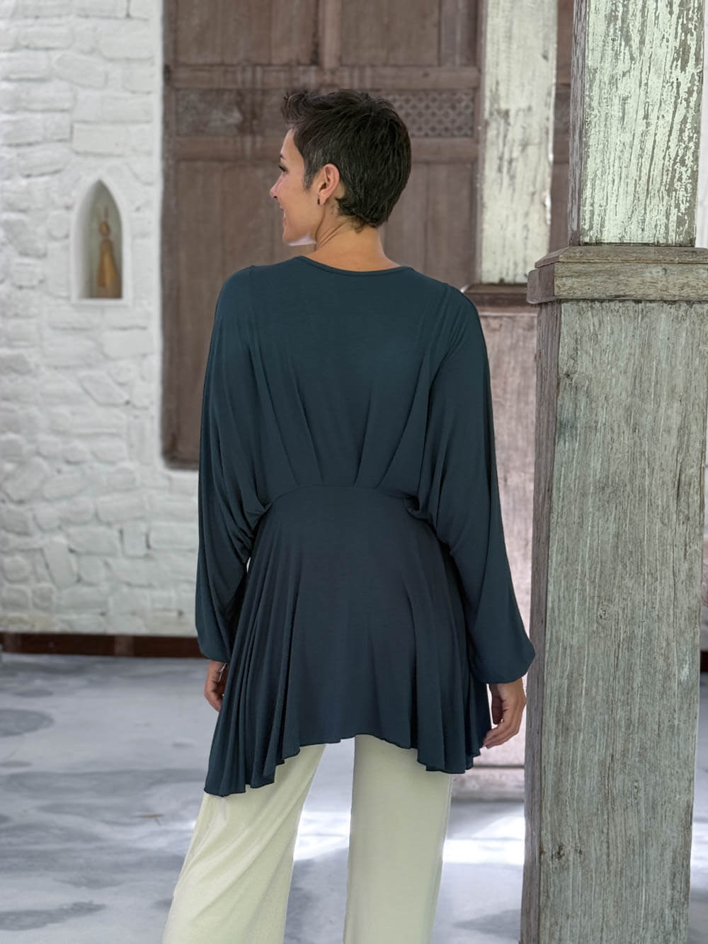 caraucci peplum tunic in teal blue lightweight rayon jersey with v neckline and asymmetrical hem #color_teal
