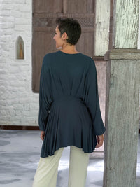caraucci peplum tunic in teal blue lightweight rayon jersey with v neckline and asymmetrical hem #color_teal