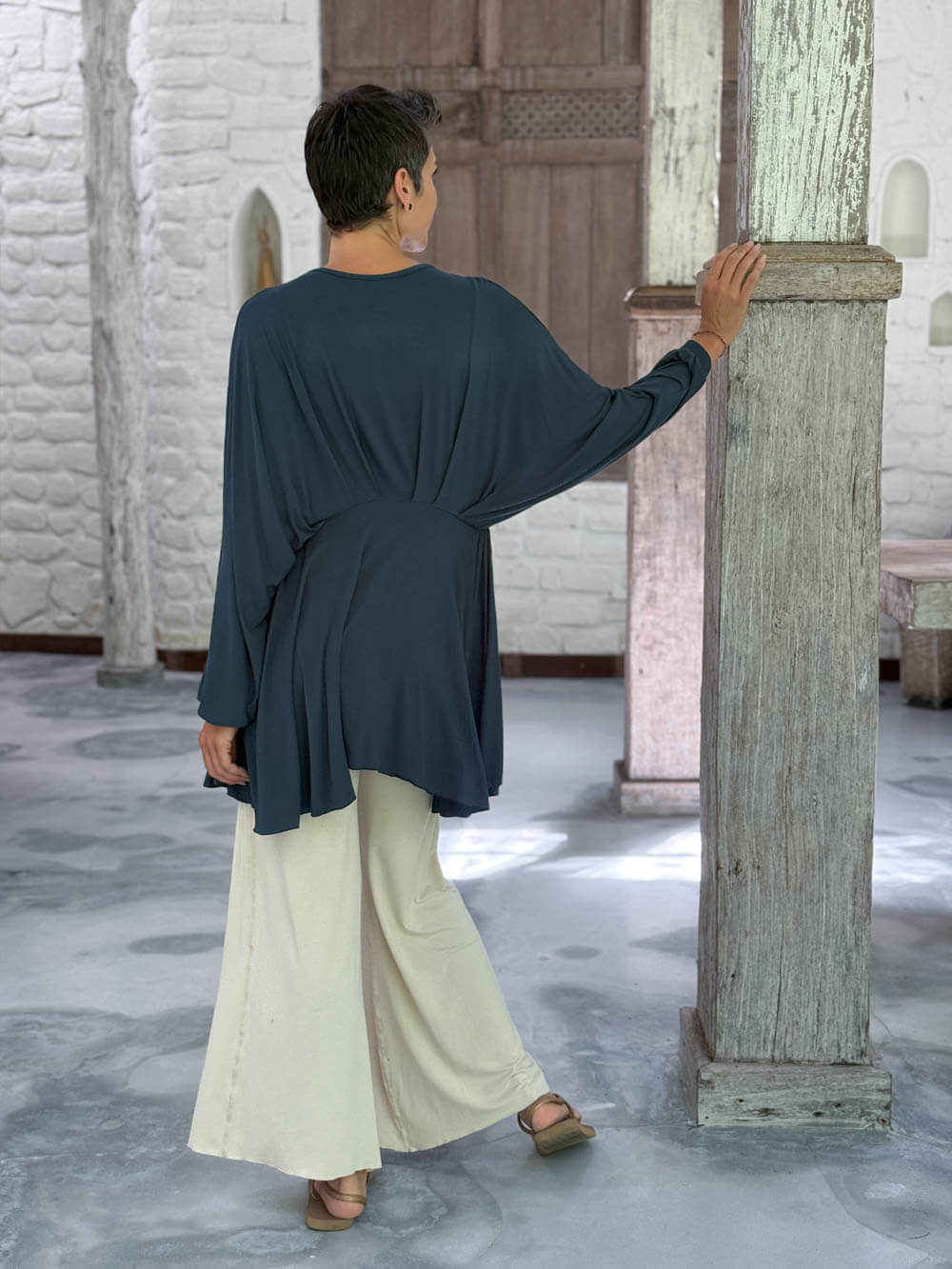 caraucci peplum tunic in teal blue lightweight rayon jersey with v neckline and asymmetrical hem #color_teal