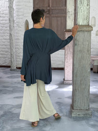 caraucci peplum tunic in teal blue lightweight rayon jersey with v neckline and asymmetrical hem #color_teal