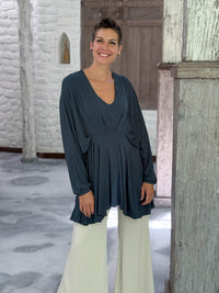 caraucci peplum tunic in teal blue lightweight rayon jersey with v neckline and asymmetrical hem #color_teal