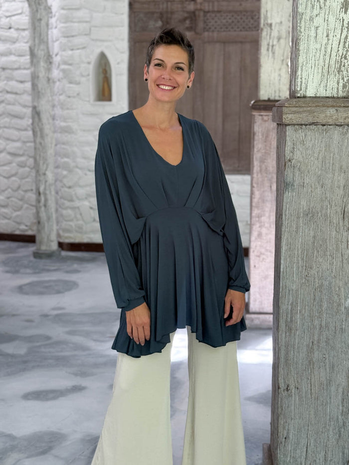 caraucci peplum tunic in teal blue lightweight rayon jersey with v neckline and asymmetrical hem #color_teal