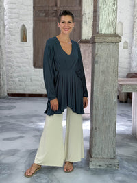 caraucci peplum tunic in teal blue lightweight rayon jersey with v neckline and asymmetrical hem #color_teal