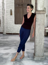 CARAUCCI Racerback Top in black crafted from soft stretch rayon jersey with navy blue movement pants #color_black