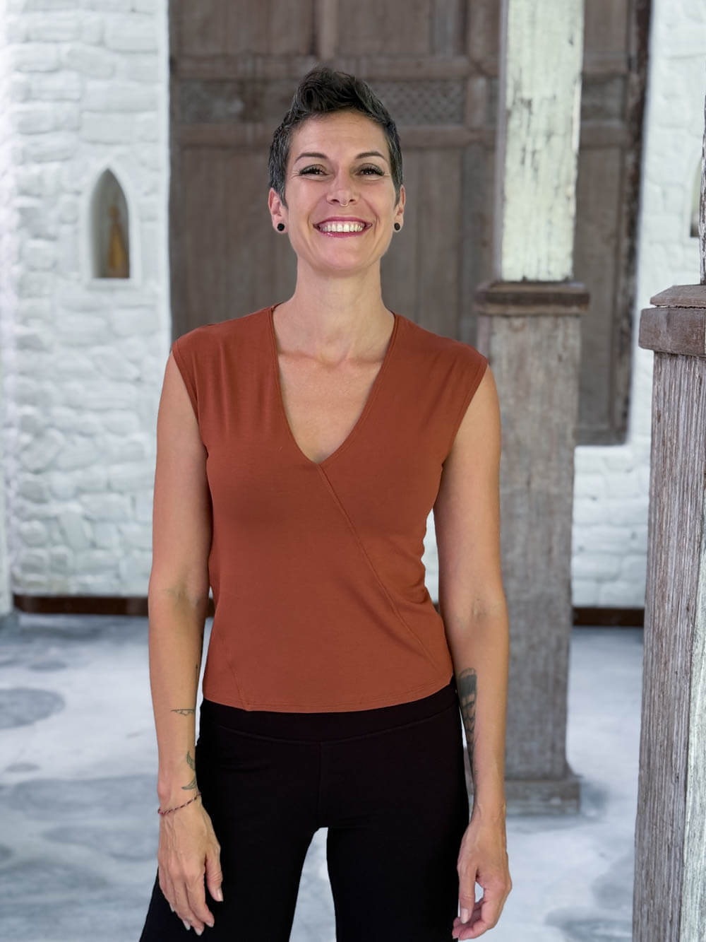 CARAUCCI Racerback Top in Copper, crafted from soft stretch rayon jersey with a V-neck and waist-length fit #color_copper