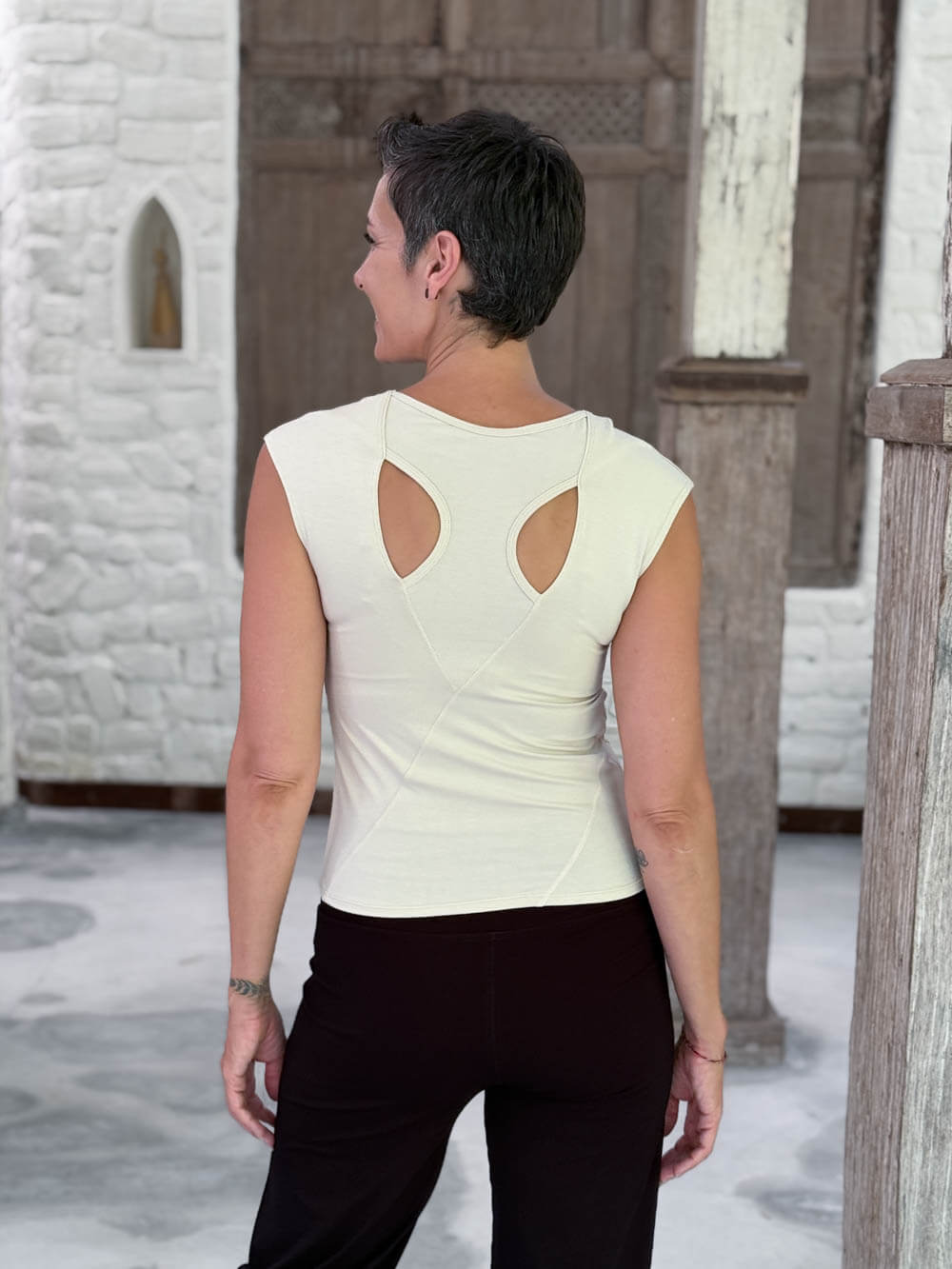 Back view of the CARAUCCI Racerback Top in cream featuring a bra-friendly racerback design #color_cream