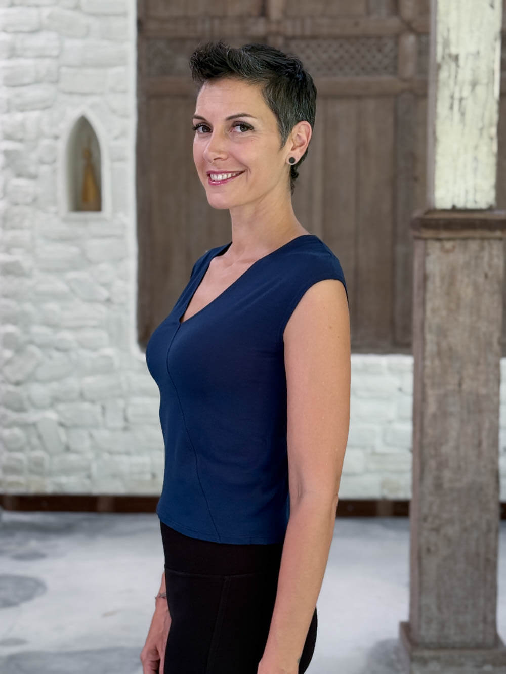 CARAUCCI Racerback Top in navy blue crafted from soft stretch rayon jersey with a V-neck and waist-length fit #color_navy
