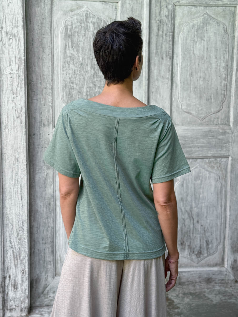 caraucci cotton soft sage green bateau tee with relaxed fit and folded neckline #color_matcha