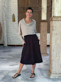 caraucci siena midi skirt in black cotton smocked waist midi skirt with pockets #color_black