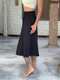 caraucci siena midi skirt in black cotton smocked waist midi skirt with pockets #color_black