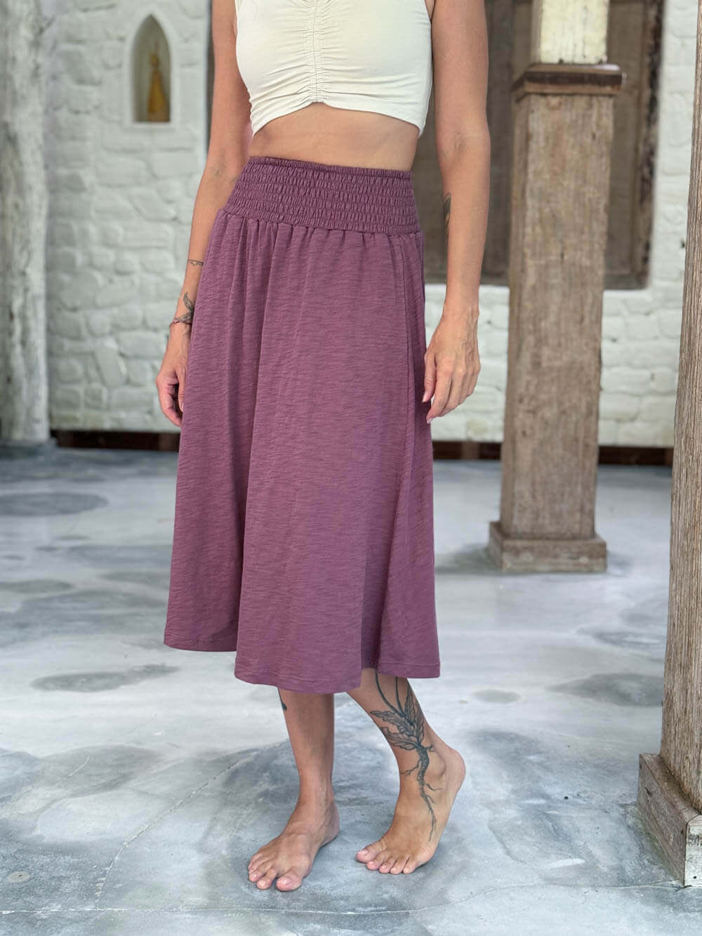 caraucci siena midi skirt in muted mauve cotton smocked waist midi skirt with pockets #color_mangosteen