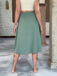 caraucci siena midi skirt in soft sage green cotton smocked waist midi skirt with pockets #color_matcha