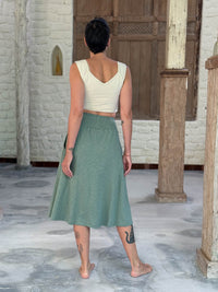 caraucci siena midi skirt in soft sage green cotton smocked waist midi skirt with pockets #color_matcha
