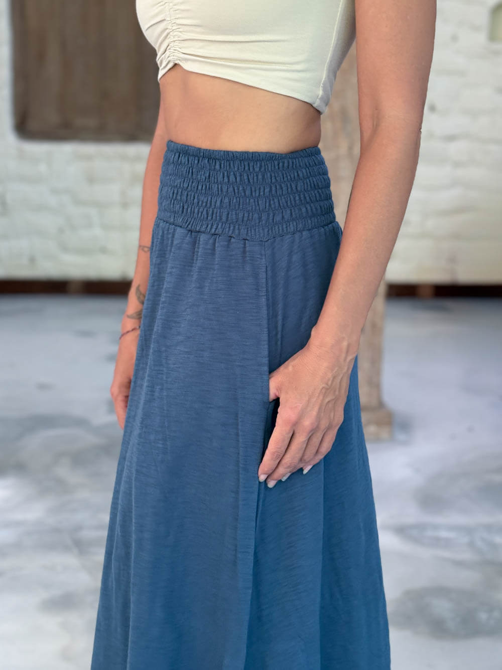 caraucci siena midi skirt in dusty ocean blue cotton smocked waist midi skirt with pockets #color_pacific