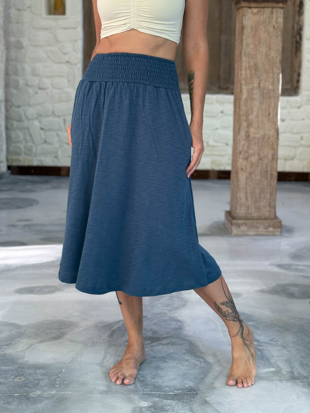 caraucci siena midi skirt in dusty ocean blue cotton smocked waist midi skirt with pockets #color_pacific