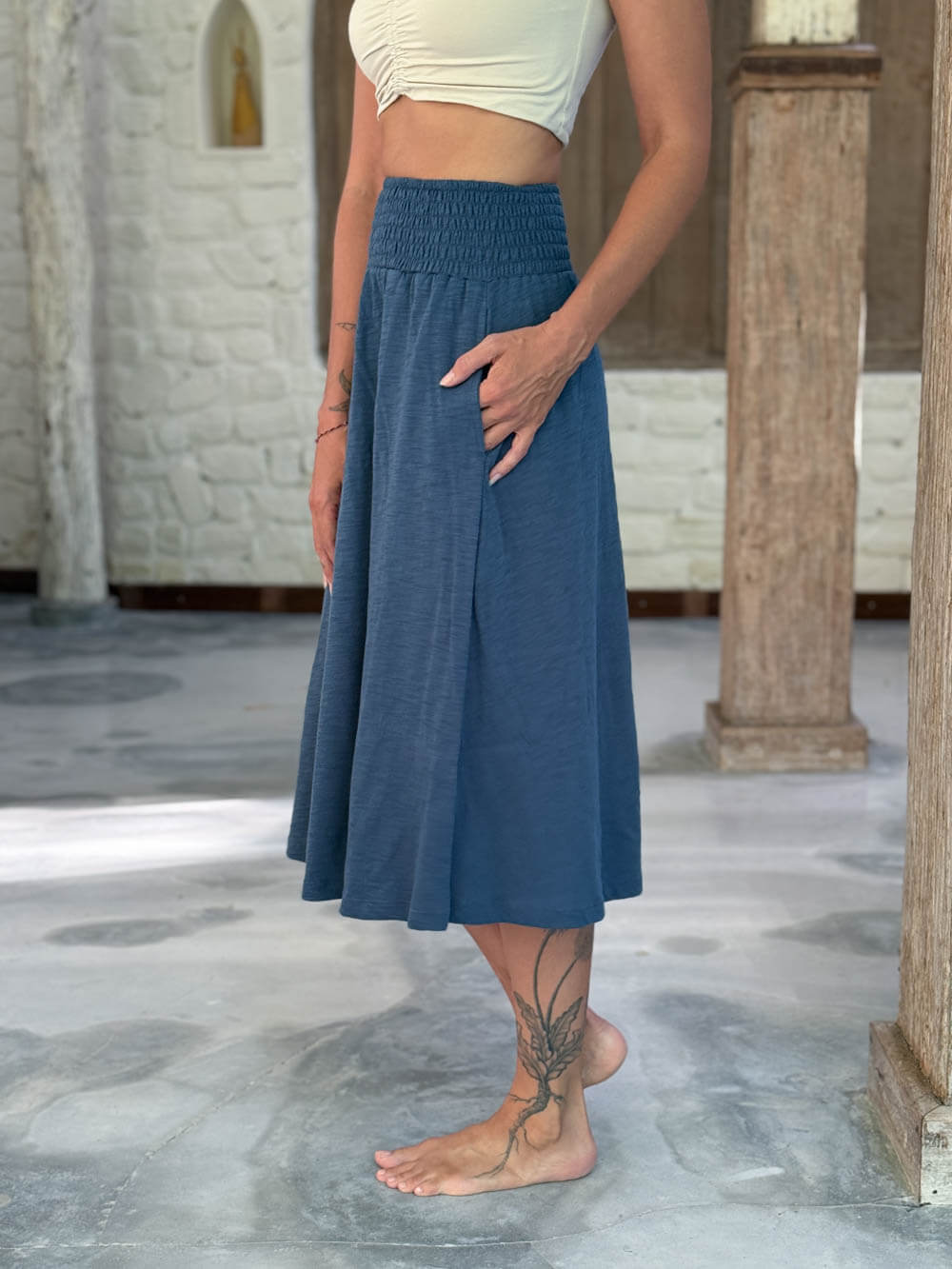 caraucci siena midi skirt in dusty ocean blue cotton smocked waist midi skirt with pockets #color_pacific