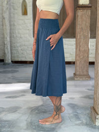 caraucci siena midi skirt in dusty ocean blue cotton smocked waist midi skirt with pockets #color_pacific