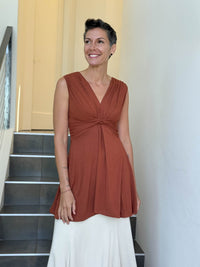 caraucci v neck sleeveless orange tunic with gathered bodice and flowing silhouette #color_copper