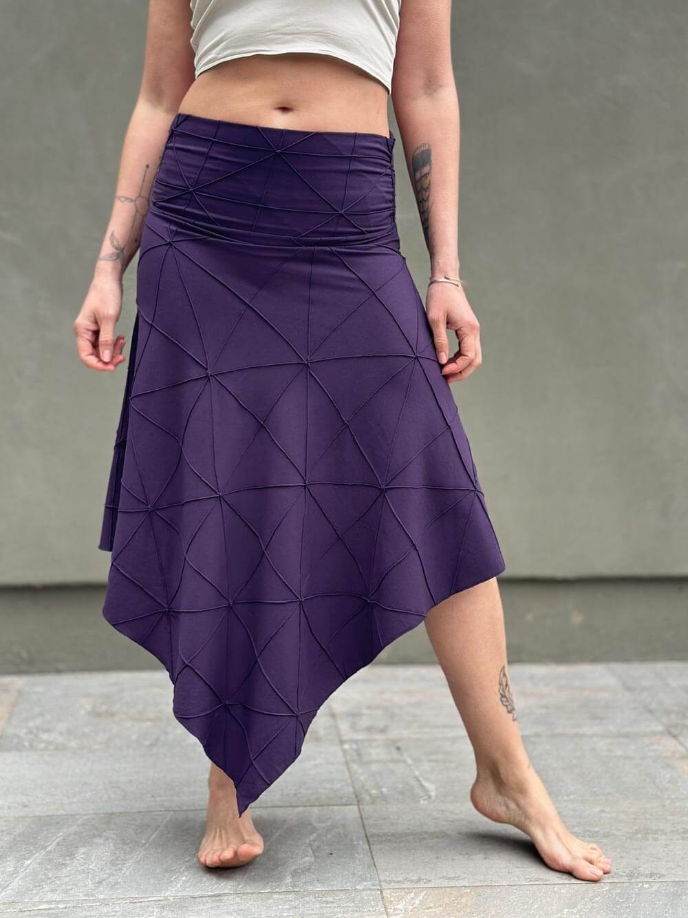 women's plant based rayon jersey stretchy asymmetrical purple midi skirt with fold-over waistband #color_plum