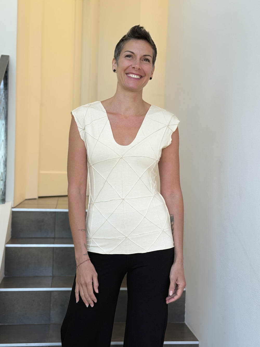 caraucci fitted cap sleeve cream top with geometric stitched texture details #color_cream