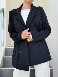 CARAUCCI Urban Lounge unstructured double-breasted black Bamboo Fleece jacket shown with cream flare pants #color_black