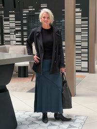 CARAUCCI Urban Lounge unstructured double-breasted black Bamboo Fleece jacket shown with teal skirt #color_black