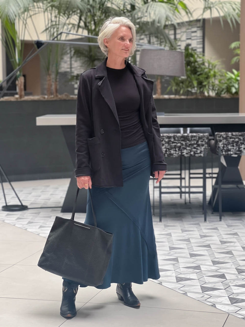CARAUCCI Urban Lounge unstructured double-breasted black Bamboo Fleece jacket shown with teal skirt #color_black