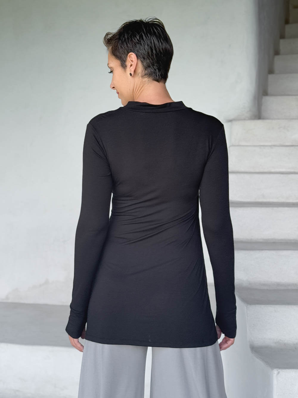 caraucci v-neck long sleeve black tunic with thumbholes #color_black